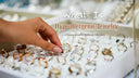 Close up picture showcases a person choosing ring in the store