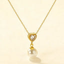 close up look of heart shape zircon necklace with pearl pendant 