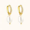 Simple pearl earrings with rhinestone on soft beige background by verosteel jewelry