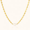 Minimalist gold necklace on light beige background by verosteel jewelry