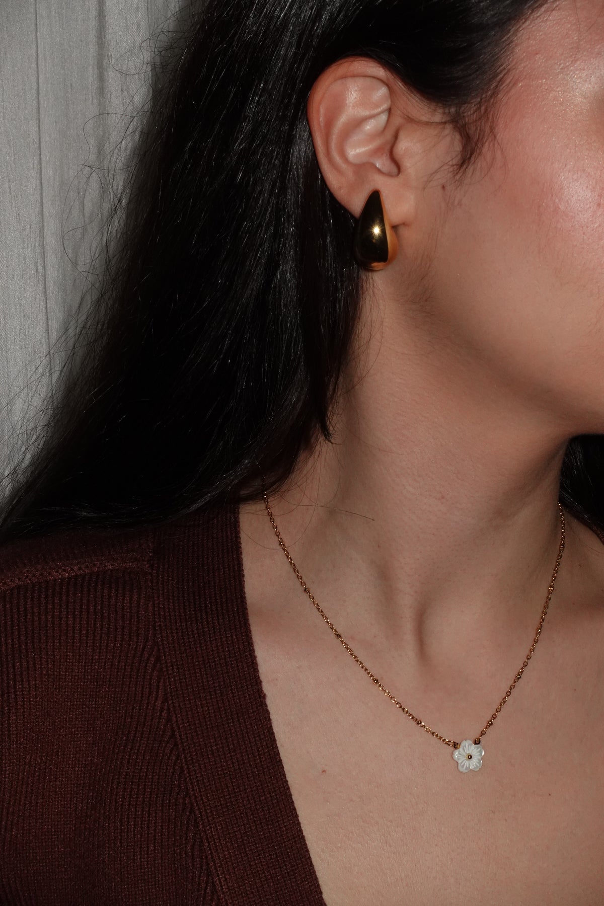 Customer wearing teardrop shape earring from verosteel