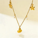 detailed look of Verosteel march updated necklace with starfish, pearl and shell pendants