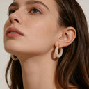 Model wearing hypoallergenic pearl drop earrings from Verosteel