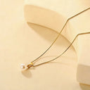 Elegant Pearl Pendant Necklace featuring a freshwater pearl and 18k gold plated chain.
