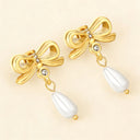 Close up look of bowknot with waterdrop pearl pendant earrings from Verosteel Jewelry