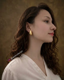 Ugc pictures from iamiroda.nyc wearing 18k gold plated teardrop earrings 