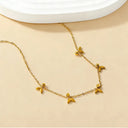 Mini fishtail necklace layer on the light beige color background