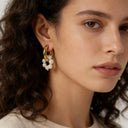 model wearing verosteel earrings with smile