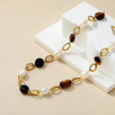 Hypoallergenic 18k gold plated chain bracelet with tiger eyes and pearl beads. 